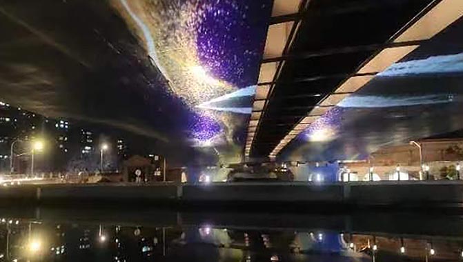The Illuminated Jiangning Road bridge over Suzhou Creek with lights reflecting on water.