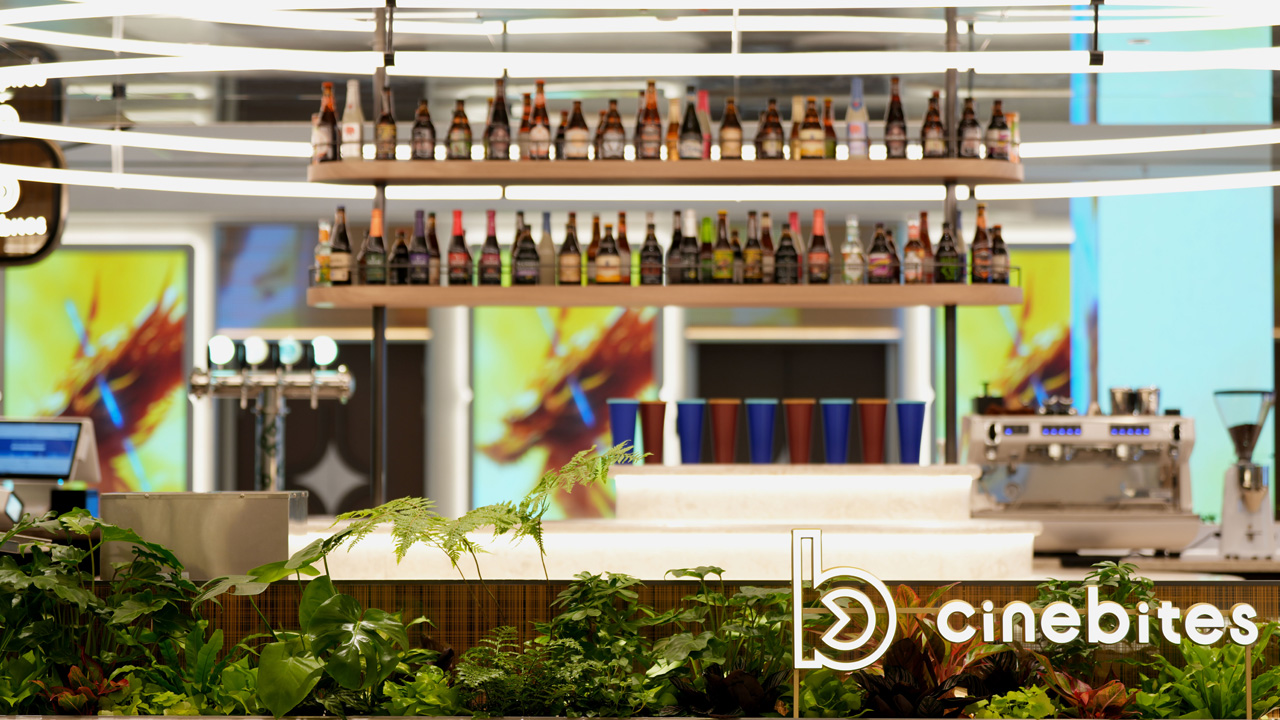 A cozy cinema bar setting, perfect for enjoying a movie with friends and drinks in a relaxed atmosphere.