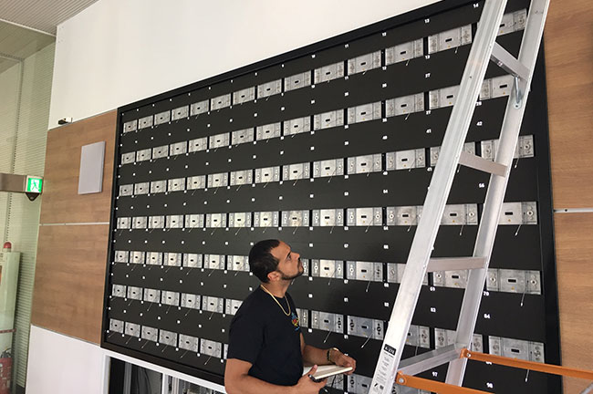 An LED technician installing MicroTiles LED