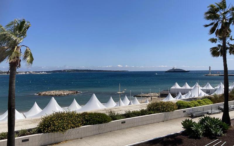 White tents set up on a beach